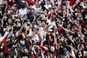Game hero Rob Phinisee is carried by a sea of ecstatic fans at Simon Skjodt Assembly Hall..