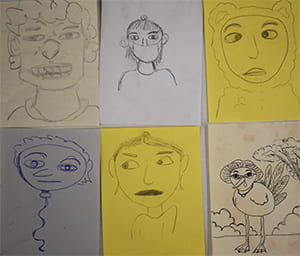 Student drawings of themselves in response to this activity, including one as a baloon-head and one as a turkey