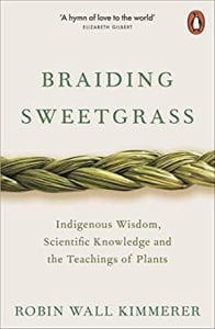 Book cover of Braiding Sweetgrass, with an image of tightly braided grass.