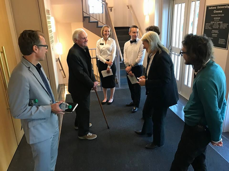 John Boorman visits with ushers, house manager Seth Mutchler and IU Cinema director Jon Vickers in IU Cinema lobby before Boorman's Jorgensen Lecture.