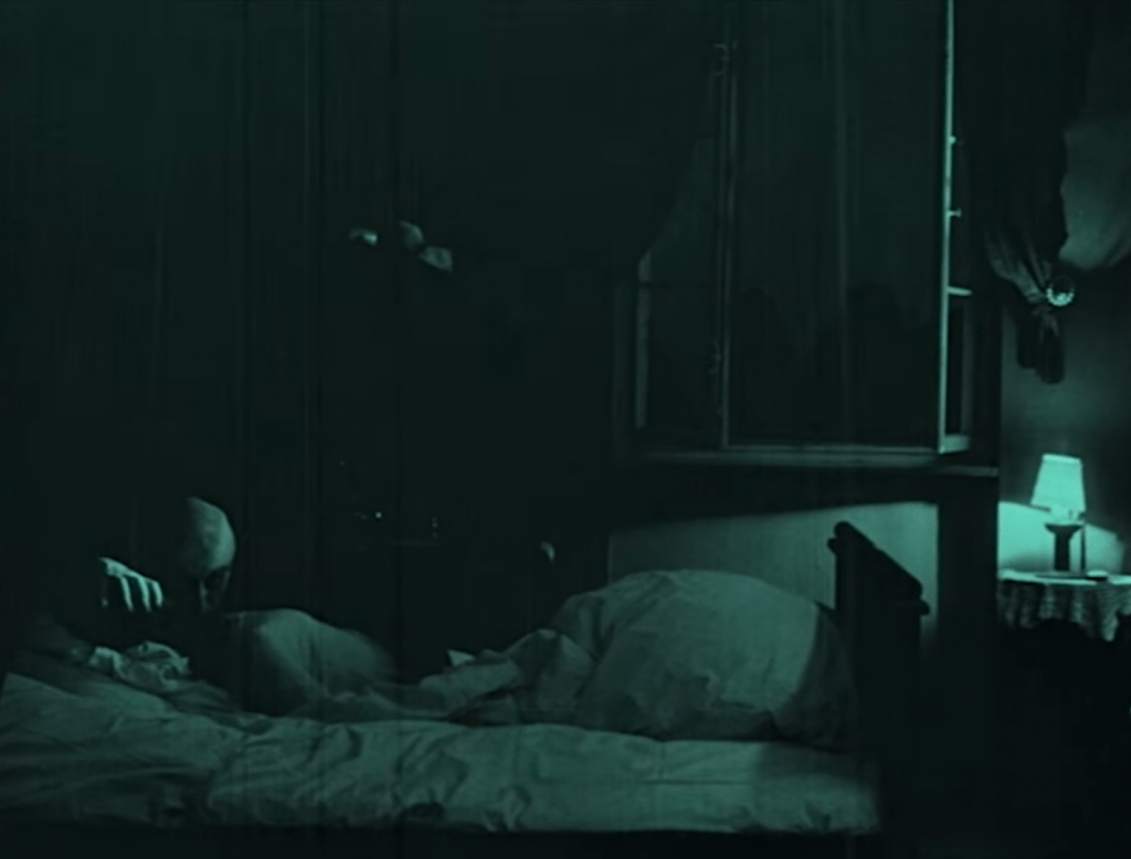 Nosferatu attacks a sleeping woman