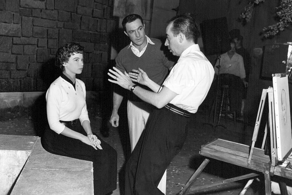 Leslie Caron and Gene Kelly listen to Vincente Minnelli on the set of An American in Paris.
