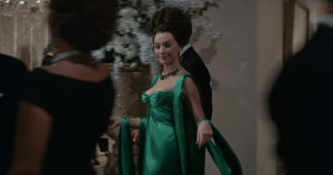 MacLaine wearing the green dress from Head's sketch