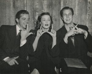 Dana Andrews, Tierney, and Vincent Price during a Lux Radio performance