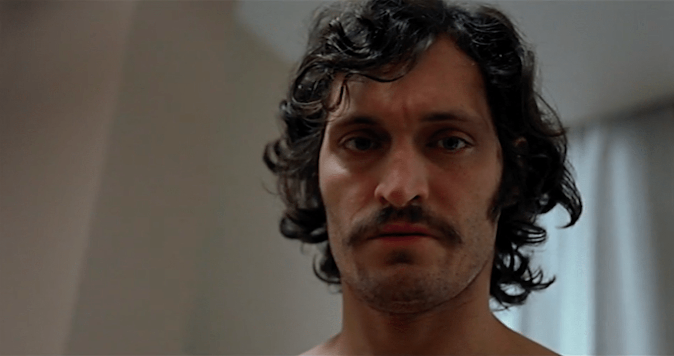 low-angled close up of Vincent Gallo