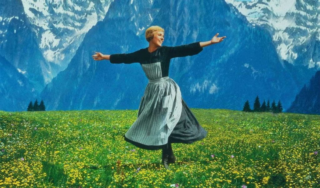 Julie Andrews on a hill in The Sound of Music (1965)