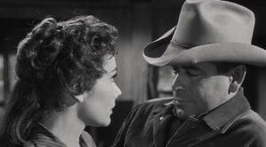 Felicia Farr and Glenn Ford look at each other