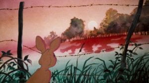An animated rabbit looks into the distance through a fence of barbed wire