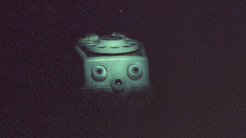 A night-vision shot of a children's telephone toy
