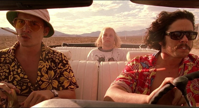 Johnny Depp, Tobey Maguire, and Benicio del Toro drive through the desert in a convertible
