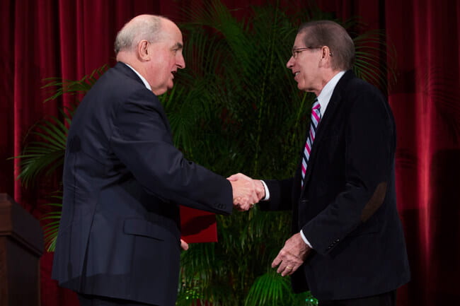 IU President McRobbie congratulates Christopher I. Beckwith on his honor of being named Distinguished Professor.