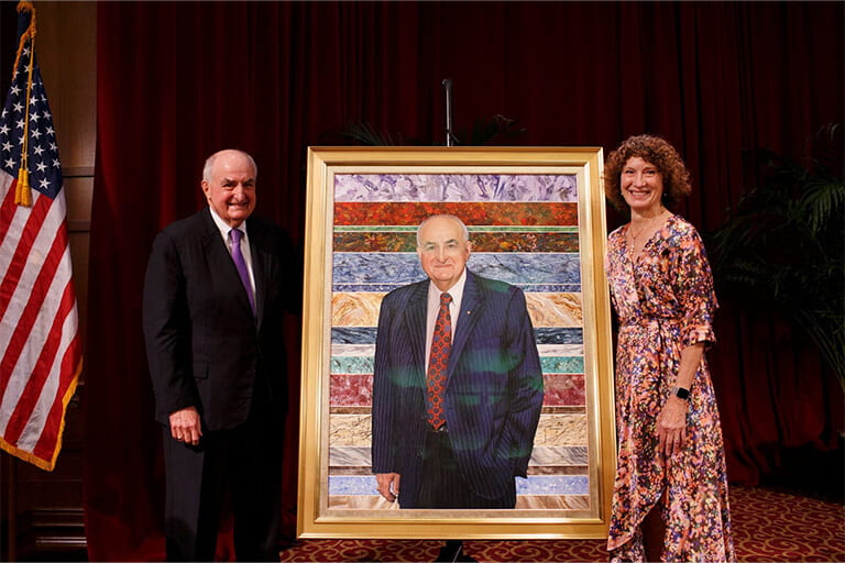 Former IU President Michael A. McRobbie and Laurie McBurns Robbie at the unveiling of McRobbie's official presidential portrait.
