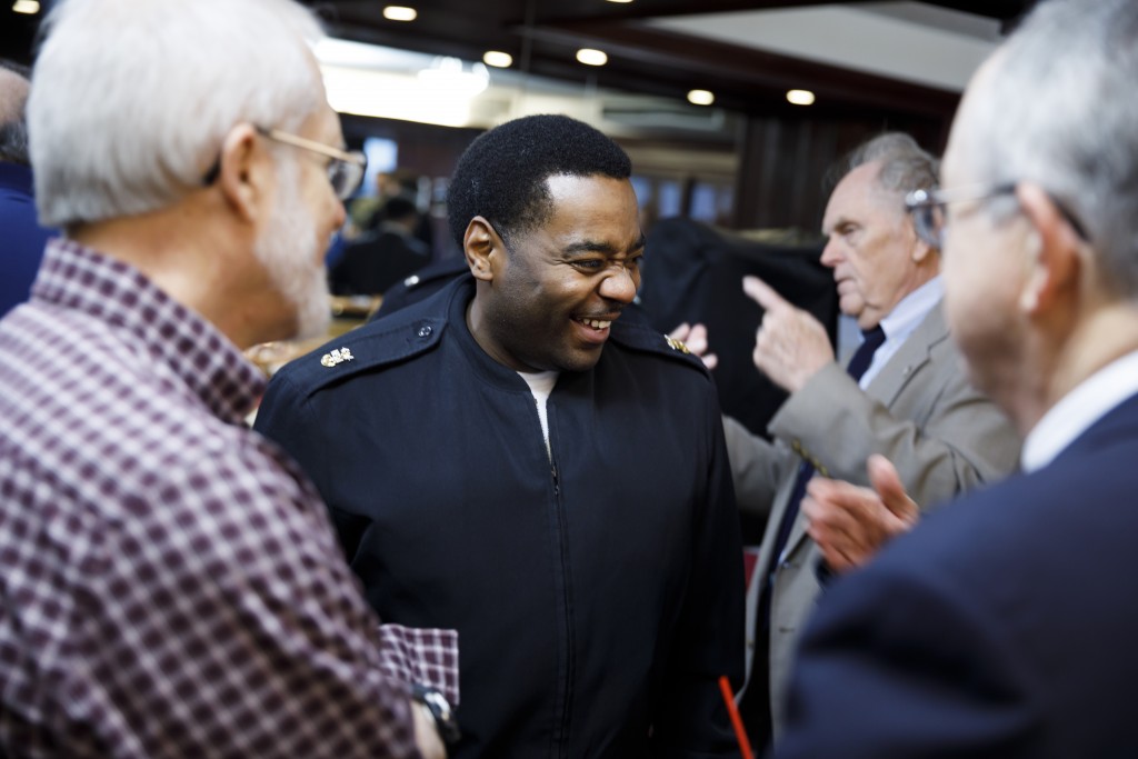 USS Indiana (SSN-789) Master Chief Lafrederick Herring, center, mingles during a reception for visitors representing the submarine at Memorial Stadium at Indiana University Bloomington on Tuesday, Jan. 10, 2017. The USS Indiana (SSN-789) is a Virginia-class submarine expected to be christened in April and commissioned sometime in 2018.