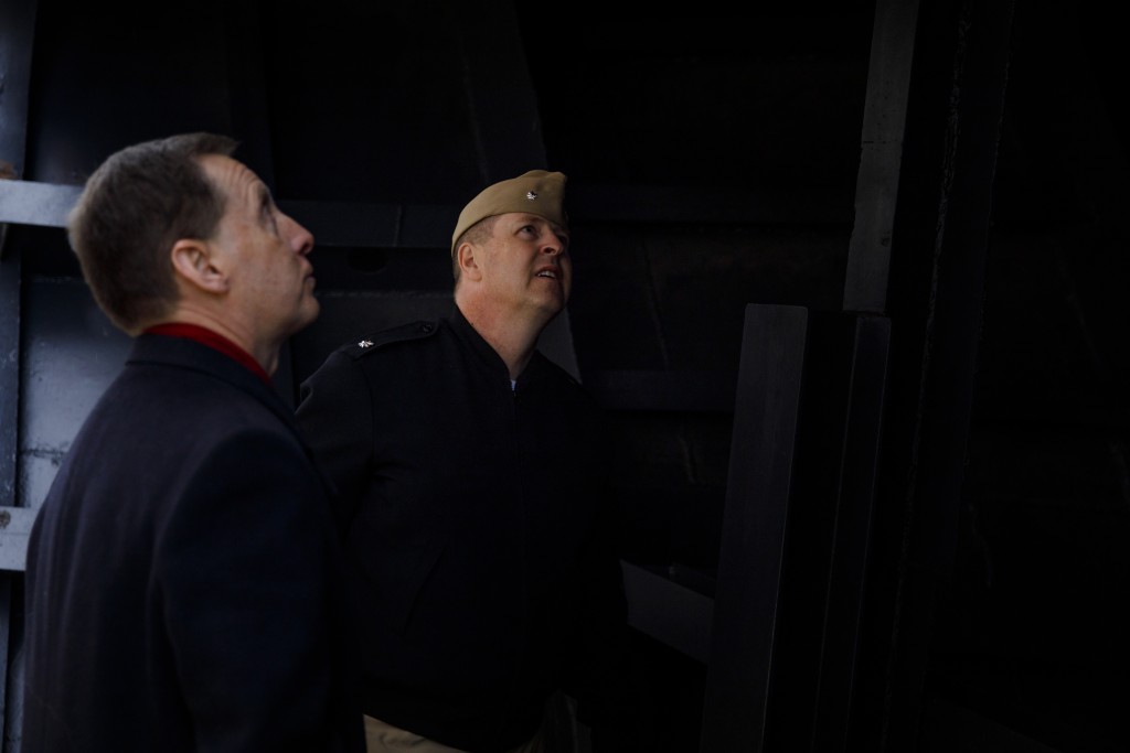 Indiana University Assistant Vice President for Strategic Partnerships Kirk White, left, gives USS Indiana (SSN-789) Commander Jesse J. Zimbauer a tour of the prow of the USS Indiana (BB-58), a WWII-era battleship, at Memorial Stadium at Indiana University Bloomington on Tuesday, Jan. 10, 2017. The USS Indiana (SSN-789) is a Virginia-class submarine expected to be christened in April and commissioned sometime in 2018.