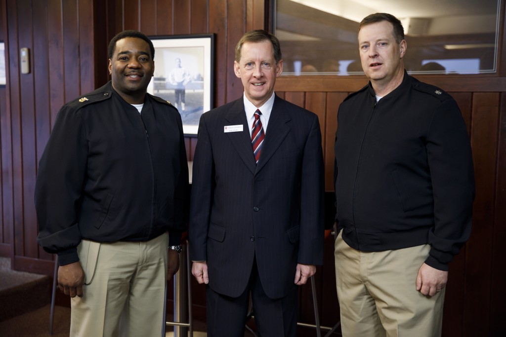 Indiana University Assistant Vice President for Strategic Partnerships Kirk White, center, poses for a photo with USS Indiana (SSN-789) Master Chief Lafrederick Herring, left, and Commander Jesse J. Zimbauer during a reception for visitors representing the submarine at Memorial Stadium at Indiana University Bloomington on Tuesday, Jan. 10, 2017. The USS Indiana (SSN-789) is a Virginia-class submarine expected to be christened in April and commissioned sometime in 2018.