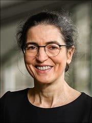 Prof. Dr. rer. nat. Brigitte Röder: A woman in in a black shirt wearing glasses.