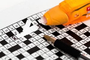 Crossword puzzle with white-out over an incorrect answer