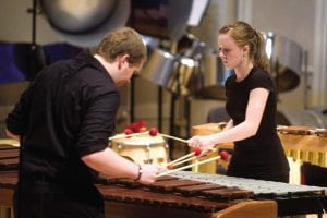 Two students playing mallet percussion instruments