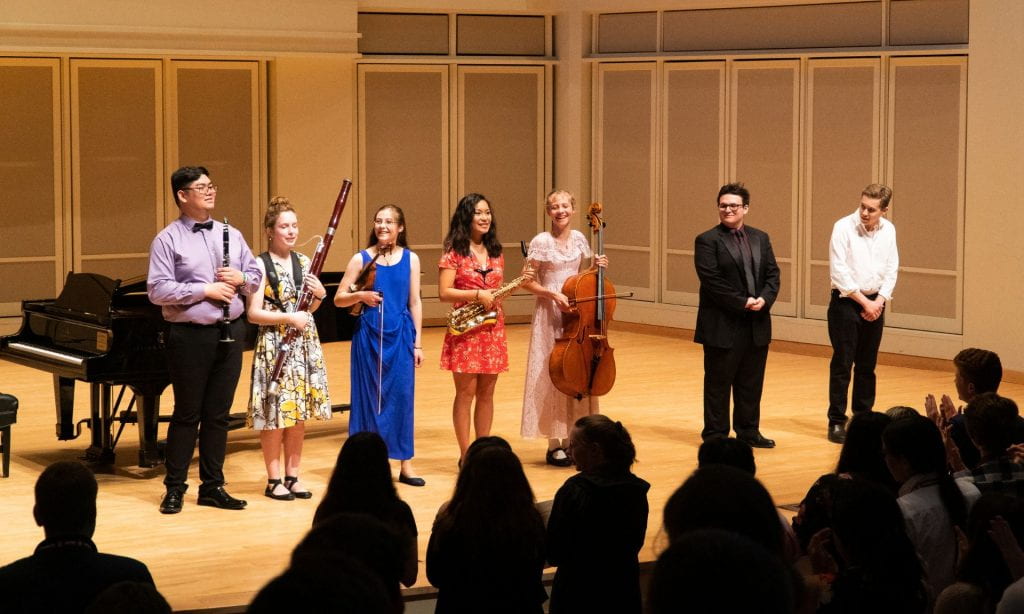 7 honors recital soloists acknowledge applause