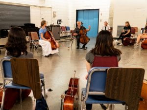 cello teacher with 10 students