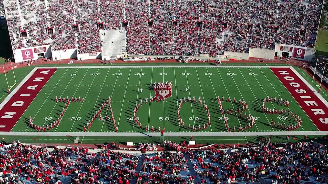 Marching hundred spells out the word Jacobs on IU memorial stadium field.