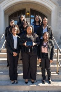 Members of the Indiana Law BLSA executive board stand in front of Baier Hall with the Midwest BLSA Medium Chapter of the Year Award.