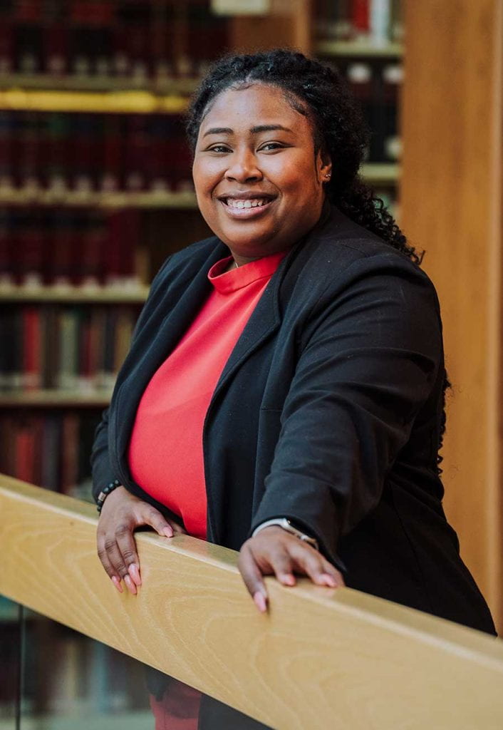 2L Nashuba Hudson is pictured in the Jerome Hall Law Library