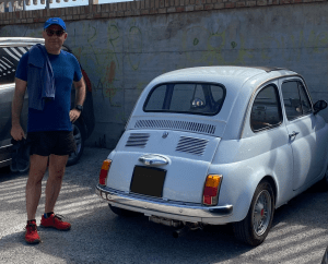 Stefano next to an old Fiat 500