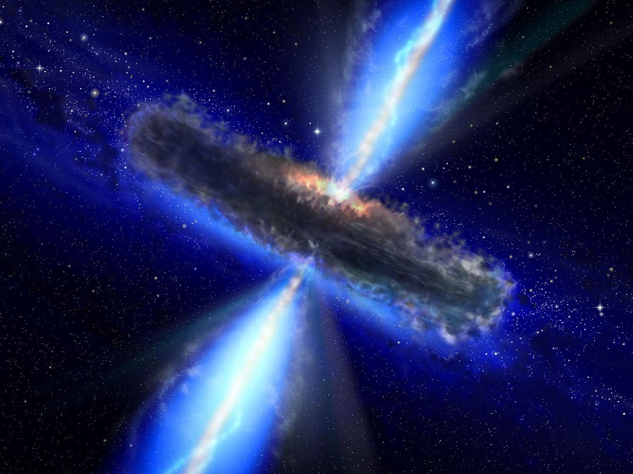 Bright blue beams of light shoot from the center of the image. A dark band of dust is perpendicular to the beam and obscures the center of the image. A translucent blue glow divides the image from top left to bottom right.