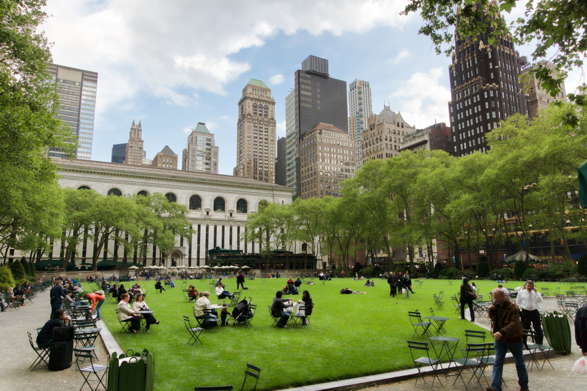 An image of people enjoying green spaces in Bryant Park in New York City