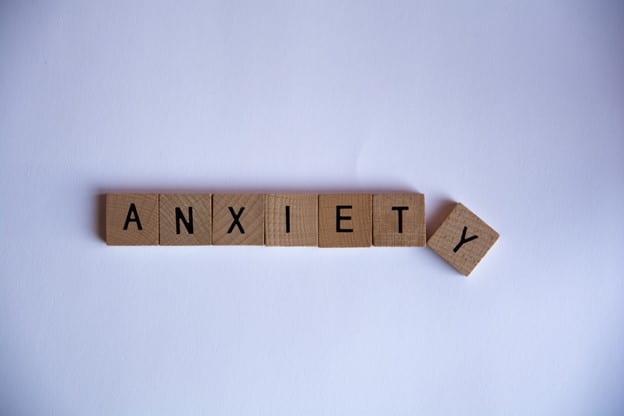 [Scrabble tiles spell the word anxiety.]