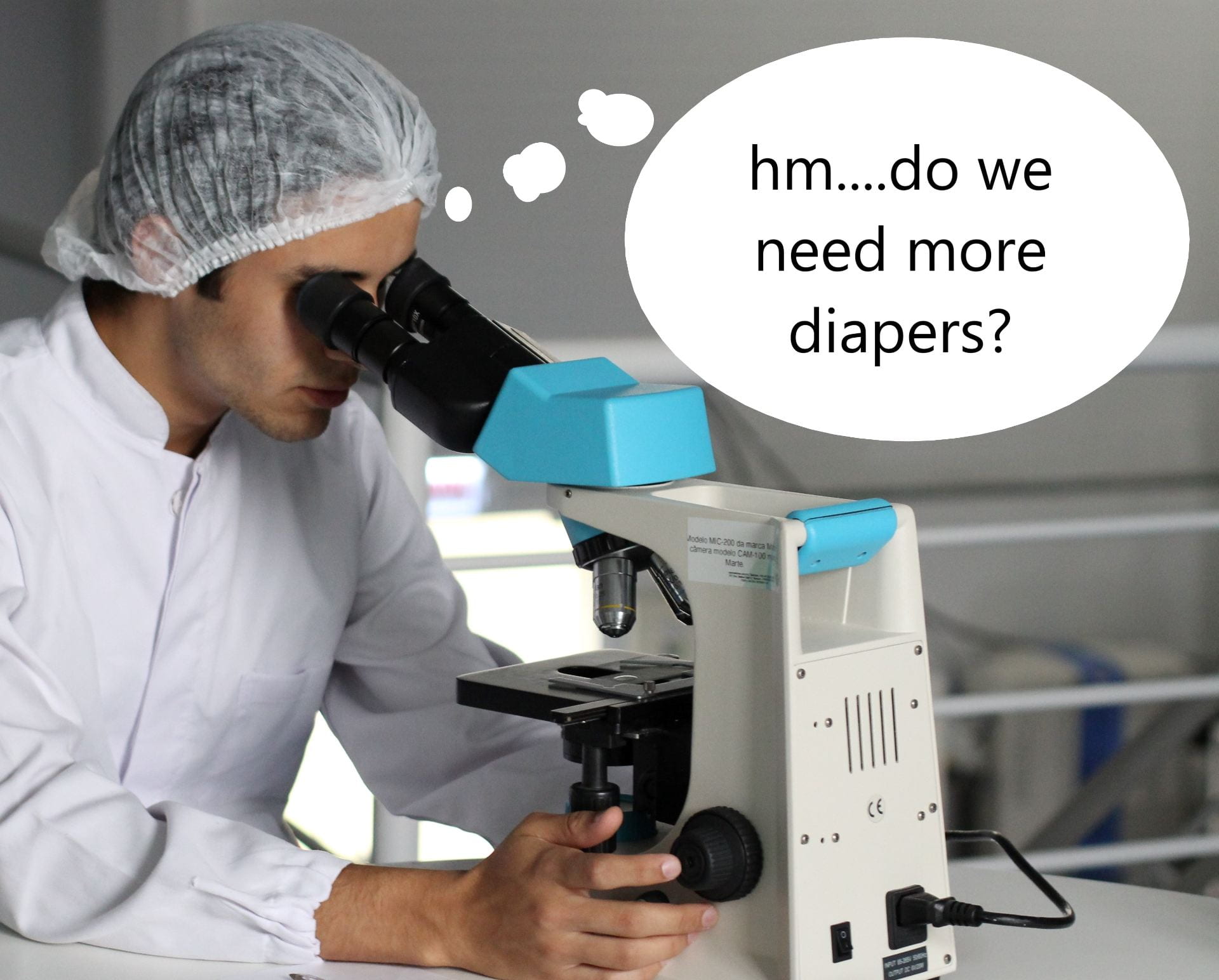  A picture of a scientist looking through a microscope and thinking ‘hm…do we need more diapers?’