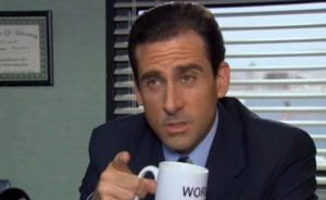 Image shows a man with a coffee mug which reads, "World's best boss"